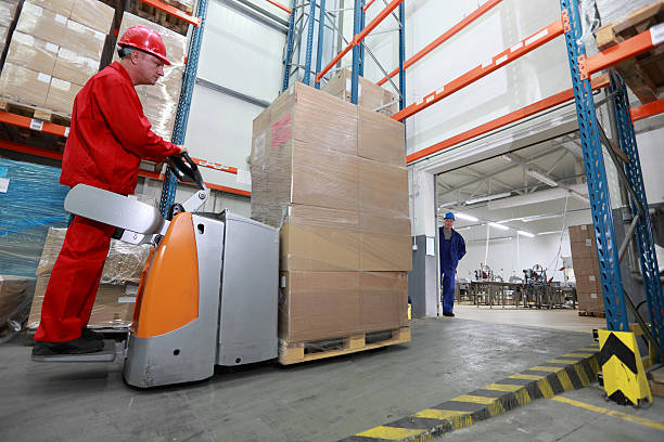 istock forklift loader with cardboard freight moving in storehouse 178825773