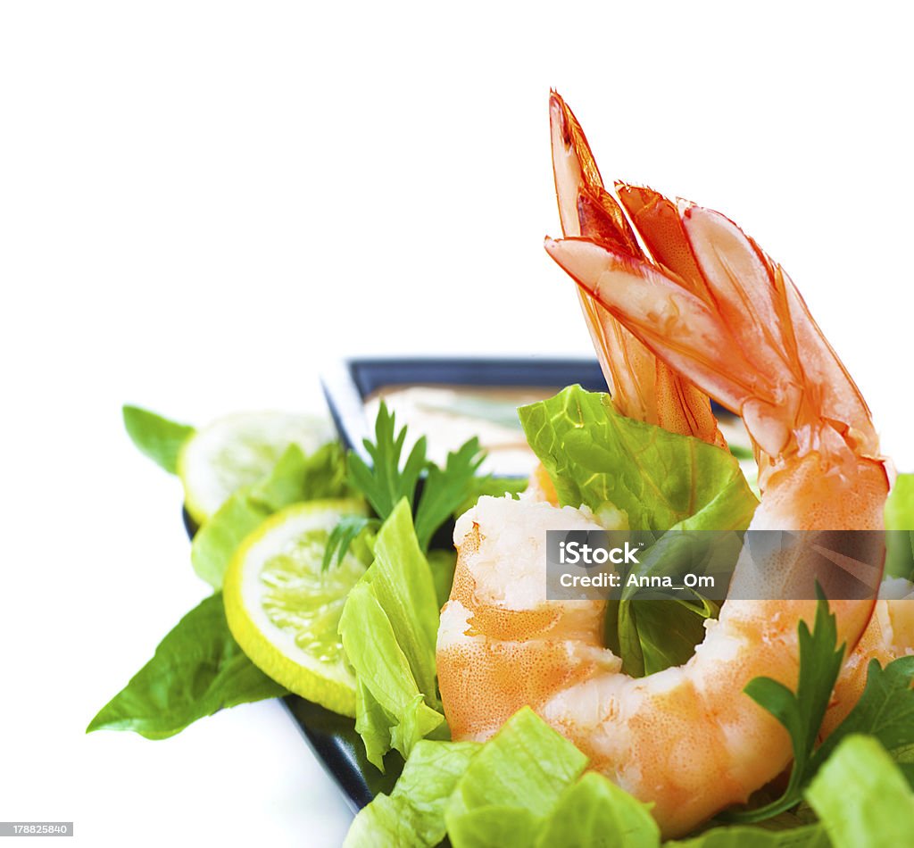 Shrimp salad Picture of green salad with shrimps, Asian cuisine, fresh seafood platter, border isolated on white background, healthy eating concept, boiled prawn with vegetables, expensive delicates Appetizer Stock Photo