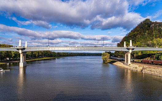 New Eisenhower Bridge of Valor in Red Wing Minnesota with river and freight train