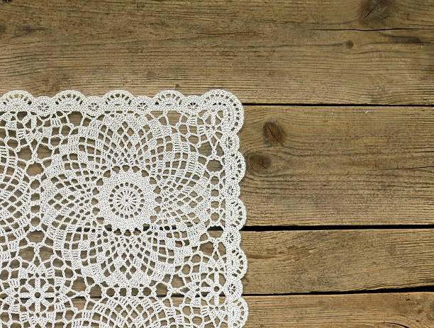 istock wooden background with white lace napkin 178827806