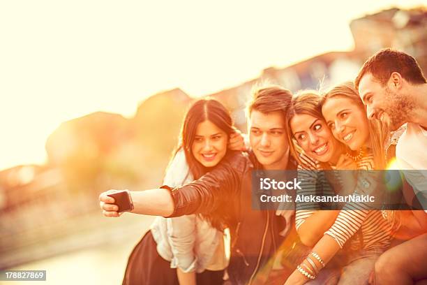Group Of Friends With A Smartphone Stock Photo - Download Image Now - 20-24 Years, 30-34 Years, Adult