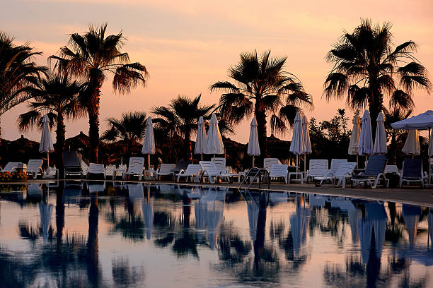 istock Beautiful swimming pool at sunset 178827919