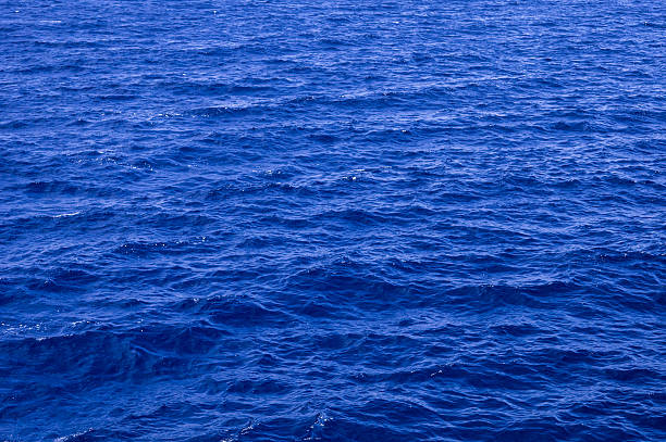 Dark blue sea water surface with ripple stock photo