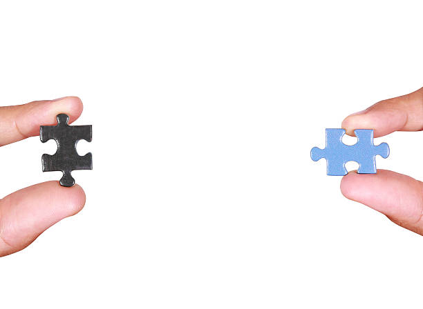 soporte de una pieza de rompecabezas en blanco - portion blue jigsaw puzzle puzzle fotografías e imágenes de stock