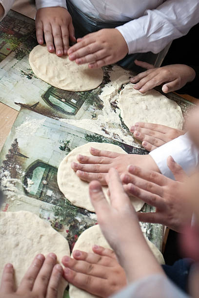 istock children arms making doughs at pizza workshop 178830673