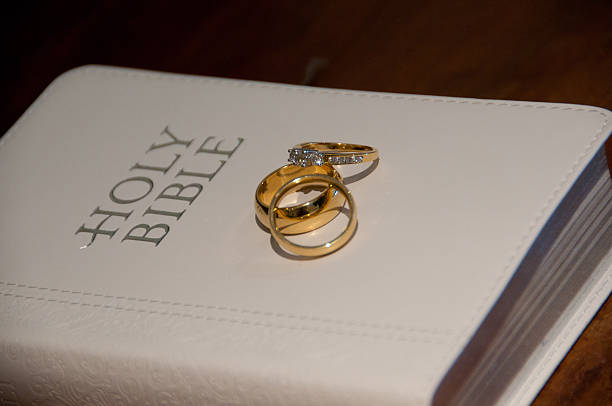 istock Holy Bible wedding engagement rings 178831760