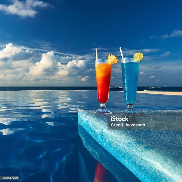 Cocktails Near Swimming Pool Stock Photo - Download Image Now - Alcohol - Drink, Blue, Blue Curacao