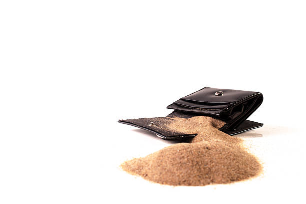 Empty purse with sand stock photo