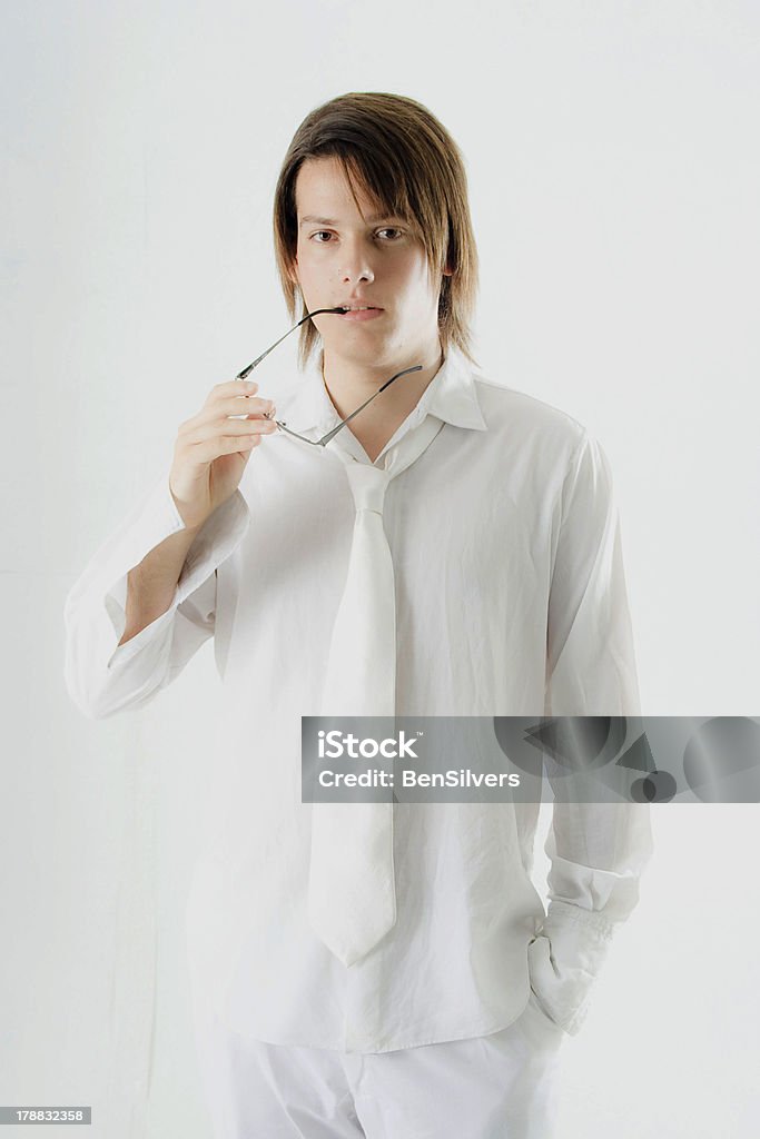 Male Model in White Outfit with Thinking expression Young Male Model in White Outfit with Thinking expression Adolescence Stock Photo