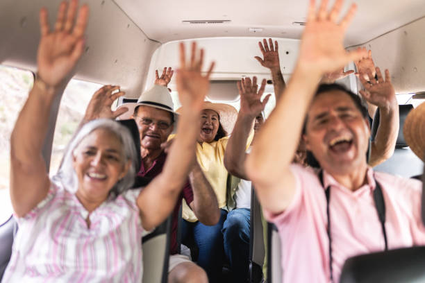 istock Senior tourists having fun with arms hands in a tour van 1788329374