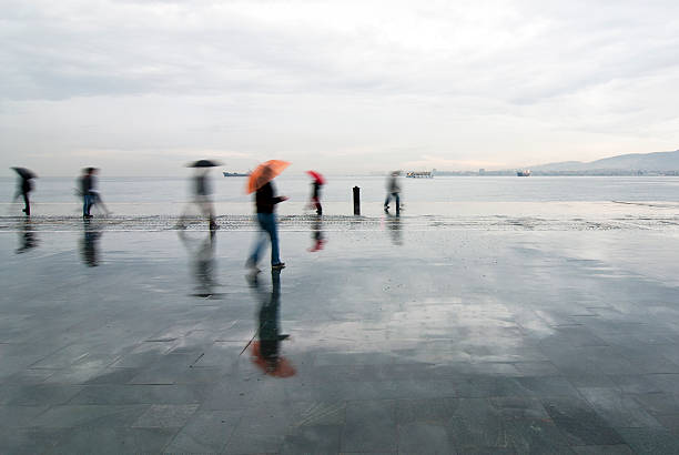 istock people walking in the rain 178832939