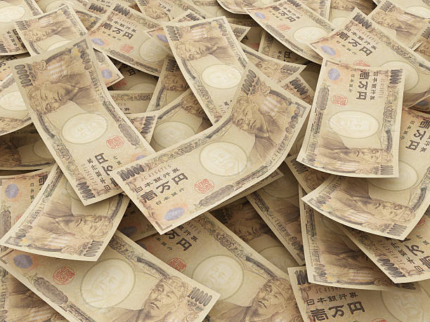 bundle of japanese yen notes - japanse valuta stockfoto's en -beelden