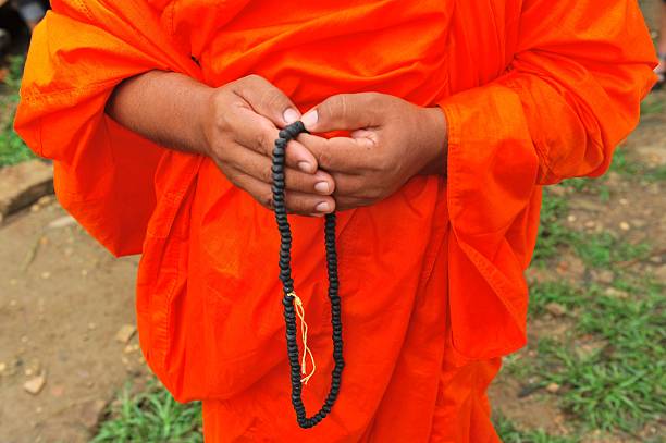 istock Prayer beads in monk s hand 178834403