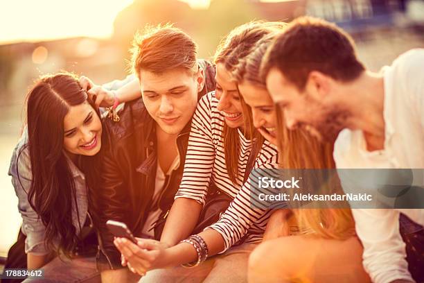 Group Of Friends With A Smartphone Stock Photo - Download Image Now - 20-24 Years, 30-34 Years, Adult