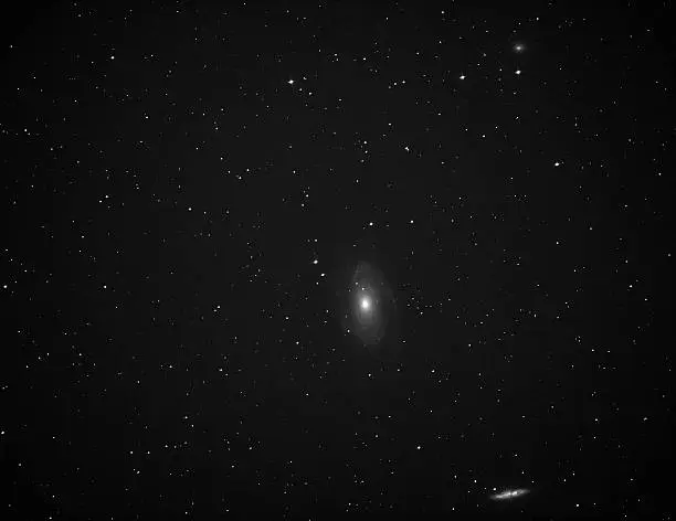 An image of Bodes Nebula (M81) and Spiral Galaxy NGC 2976, and Spiral Galaxy M82.