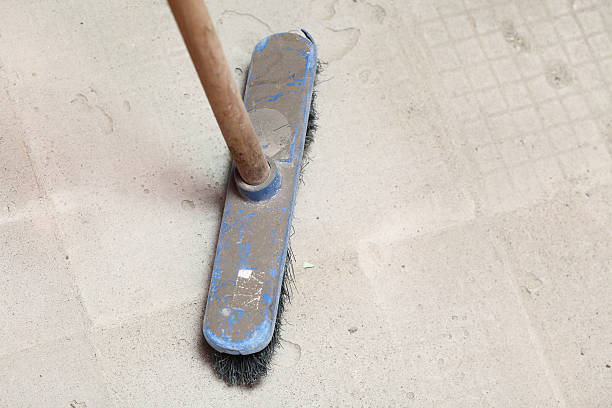 istock rough concrete at  job site using a large broom 178835459