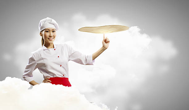 istock Asian female cook making  pizza 178836464