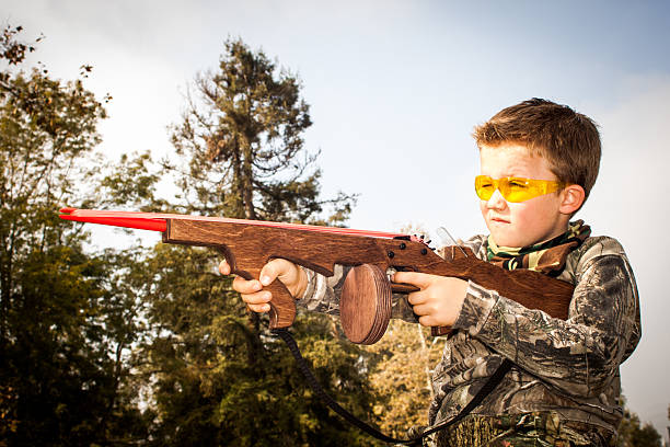istock Boy Playing with Toy Rubber Band Gun 178836485