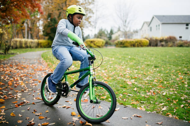 istock Boy Rides Bike With Cast on His Broken Arm 1788383424