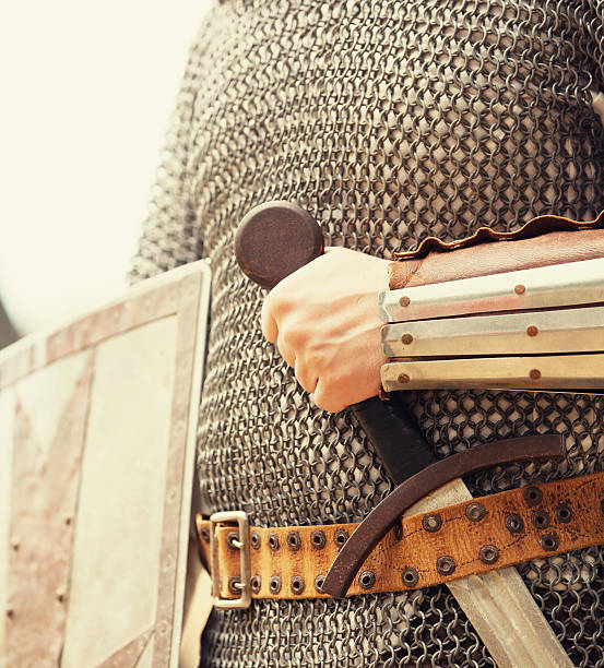 istock A knight in chain mail armor with sword tucked in belt 178838429
