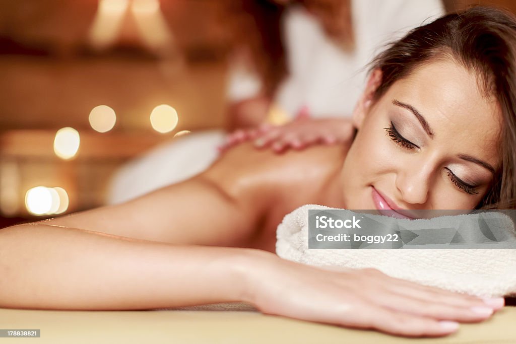 Massage Young woman having a massage 20-24 Years Stock Photo