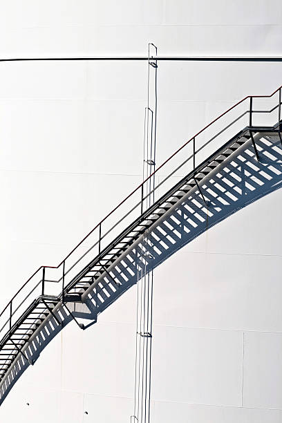 istock white tanks in tank farm with staircase 178839716