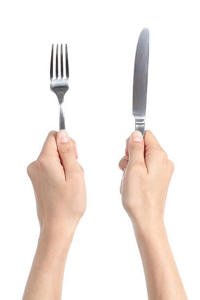 istock Woman hands holding a fork and table knife 178840835