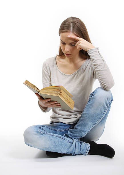 istock Young woman with book 178841154