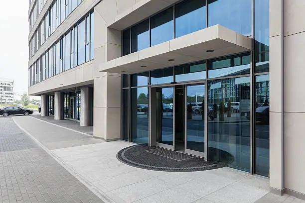 Closeup of a glass entrance to office building