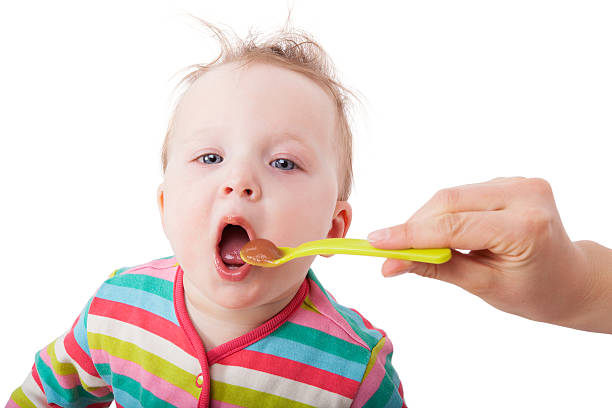istock Baby girl eating. 178842192