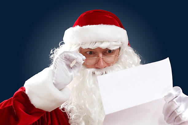 istock santa claus reading a letter 178842454