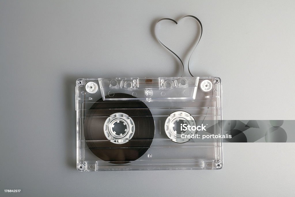 Love the music Vintage audio cassette with loose tape shaping a heart Abstract Stock Photo