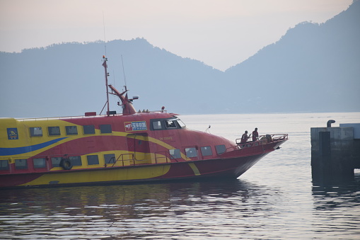 The fast boat that connects Dili City with Atauro Island, Timor Leste is looking for a berth at the port of Tibar on February 18, 2023