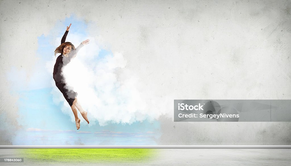 Modern style dancer posing Portrait of a dancing young woman with white cloudy smoke around Activity Stock Photo