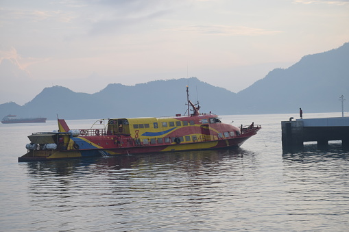 The fast boat that connects Dili City with Atauro Island, Timor Leste is looking for a berth at the port of Tibar on February 18, 2023