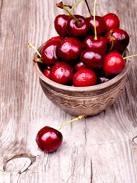 istock Cherries on wooden table 178843778