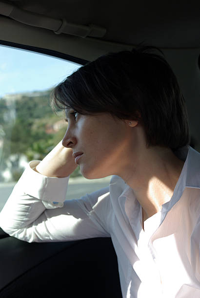 istock Sad woman in car 178844861