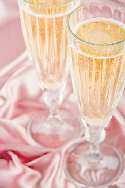 istock Sparkling wine on pink satin background 178845960