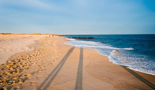 Long evening shadows on the beach at Cape May, New Jersey.
