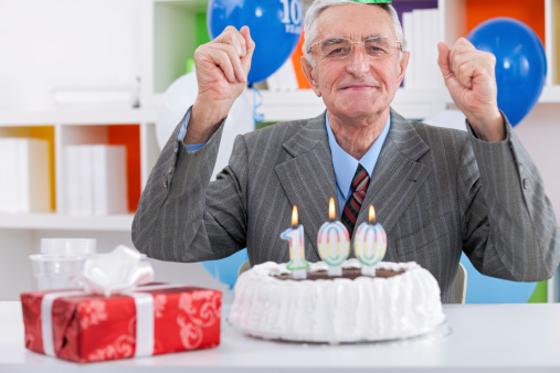 Happy senior man celebrating birthday
