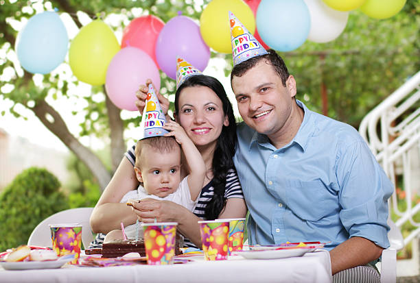 istock Kid celebrating birthday with parents 178847517