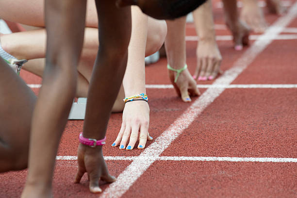 istock different woman's hand in the starting block 178847544
