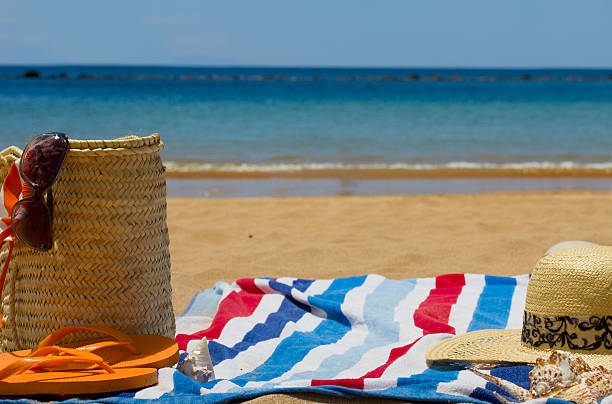 istock towel and sunbathing accessories on  bech 178848024