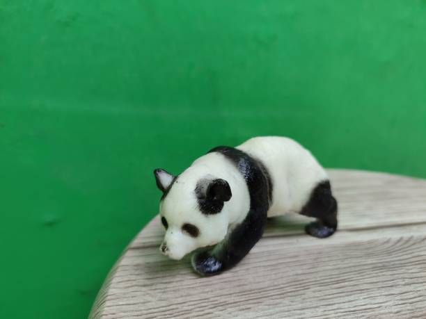 istock Panda miniature on a green background 1788493299