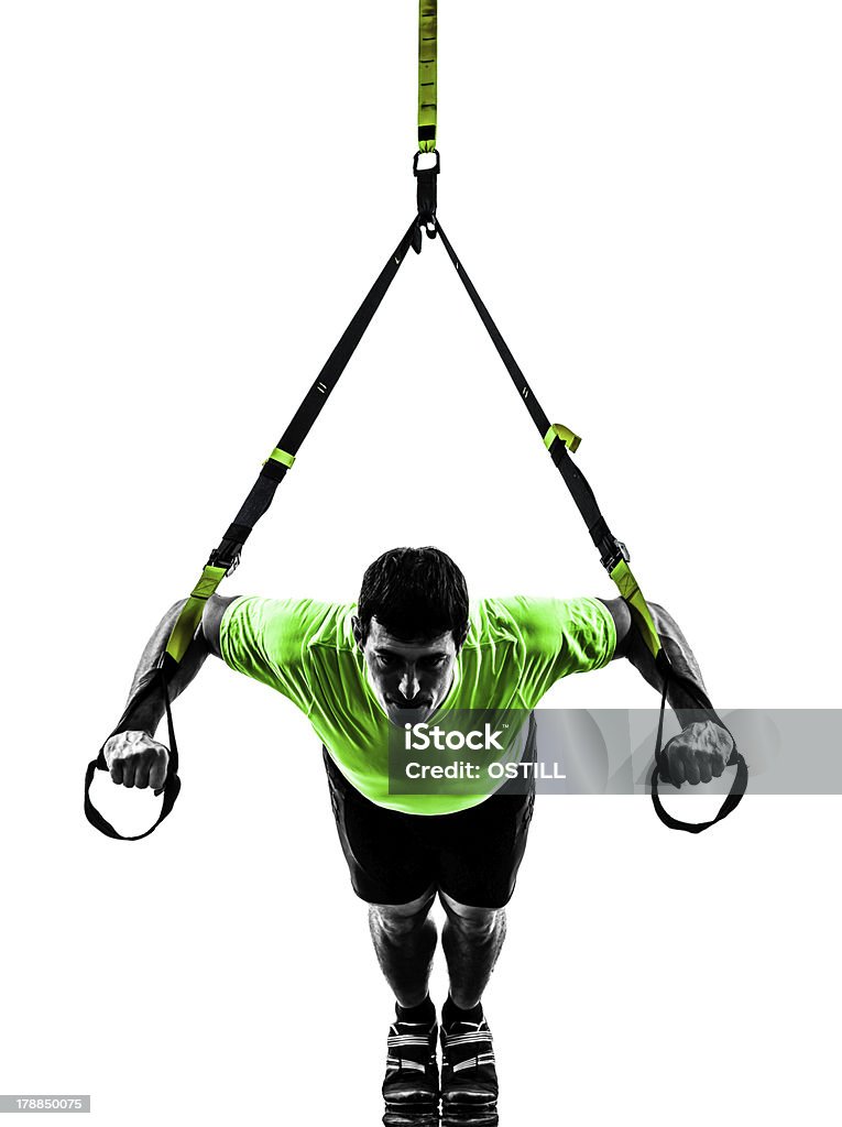 Hombre ejercicio de entrenamiento en suspensión trx silueta - Foto de stock de Entrenamiento en suspensión libre de derechos