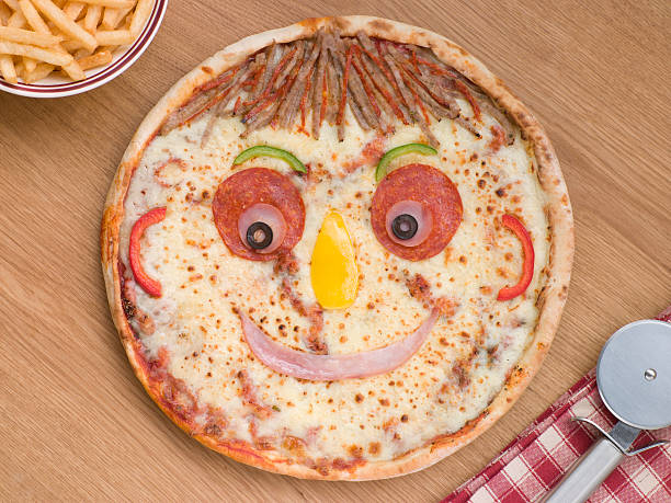 istock Smiley Faced Pizza with a Portion of Chips 178850311