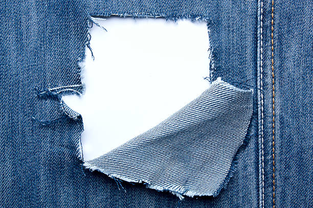 фон-джинсы с прорехами и место для текста - джинсовая ткань стоковые фото и изображения
