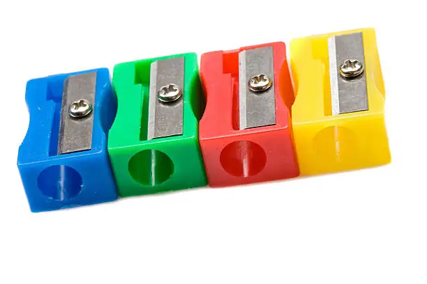Photo of four pencil-sharpener on a over white background