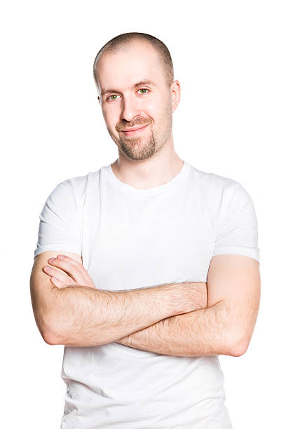 istock Handsome smiling young man with folded arms in white t-shirt 178851121