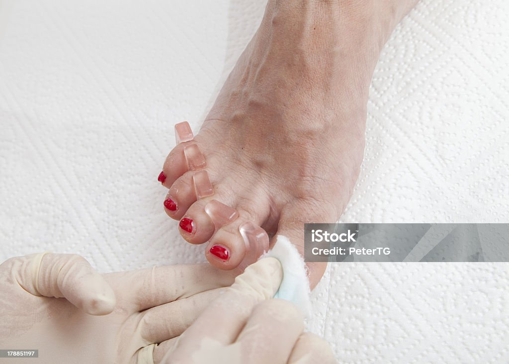 Process of foot nail varnishing Process of foot nail varnishing, series of photos, Close up of a beautician preparing and applying a nail polish  to a client's feet, series of STEP BY STEP nail varnishing process, HIGH RESOLUTION photos, Closeup, selective focus Adult Stock Photo